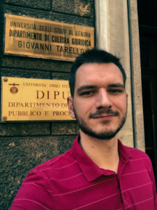 Wojciech Rzepiński in view of the Tarello Institute for Legal Philosophy at the University of Genoa (Istituto Tarello per la filosofia del diritto - Università degli Studi di Genova, Italy) signboard